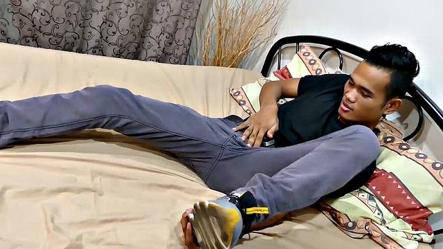 Joshua is a kinky Asian boy, who gets off on male feet. He just got home from a long day at work, and nothing turns him on more than the sweet aroma of feet that have spent all day penned up in his shoes.