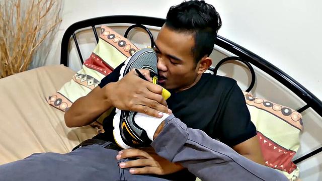 Joshua is a kinky Asian boy, who gets off on male feet. He just got home from a long day at work, and nothing turns him on more than the sweet aroma of feet that have spent all day penned up in his shoes.
