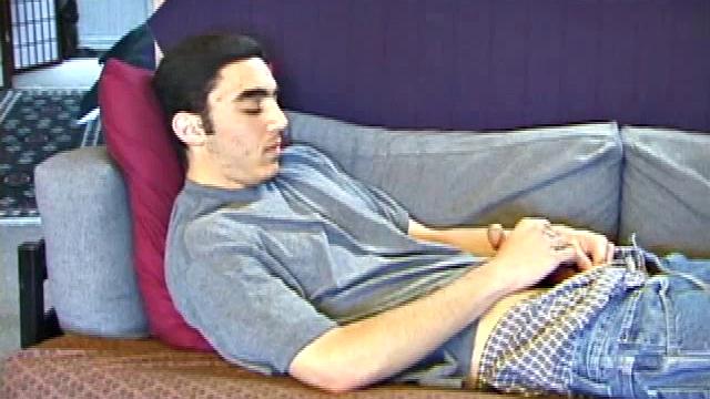 After a close-up of jeans being unzipped, Karod kicks back on the sofa and rubs a growing bulge through his boxers. If his complexion is less than perfect, his lean torso, hairy legs and thick happy trail more than compensate.