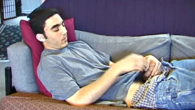 After a close-up of jeans being unzipped, Karod kicks back on the sofa and rubs a growing bulge through his boxers. If his complexion is less than perfect, his lean torso, hairy legs and thick happy trail more than compensate.