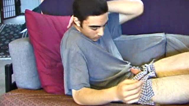 After a close-up of jeans being unzipped, Karod kicks back on the sofa and rubs a growing bulge through his boxers. If his complexion is less than perfect, his lean torso, hairy legs and thick happy trail more than compensate.