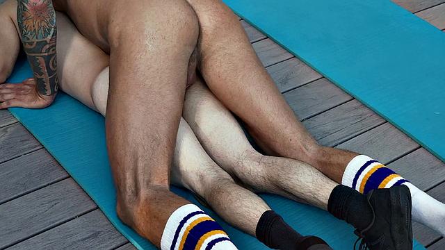 Tiny twink rides athletic inked hunk outdoors