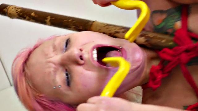 Tird up slut gagging on cock