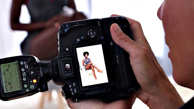 Watch as photographer devours hairy muff of black model in high heels and baseball cap