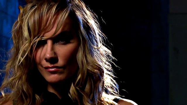 Blonde goddess dominates her bound and gagged slave with a massive strapon