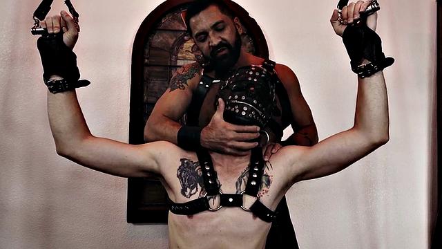 Submissive masked stud assfisted by dominant hunk