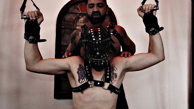 Submissive masked stud assfisted by dominant hunk