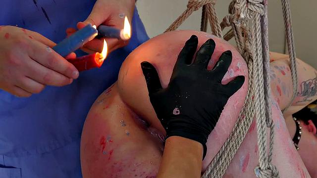 BDSM slut gagging on strapon