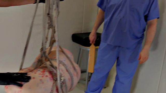 BDSM slut gagging on strapon