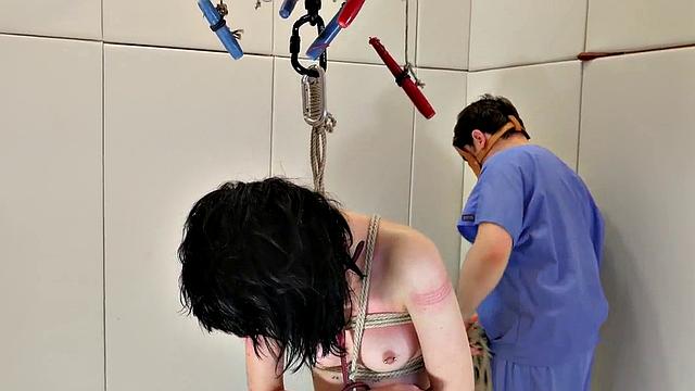 BDSM slut gagging on strapon