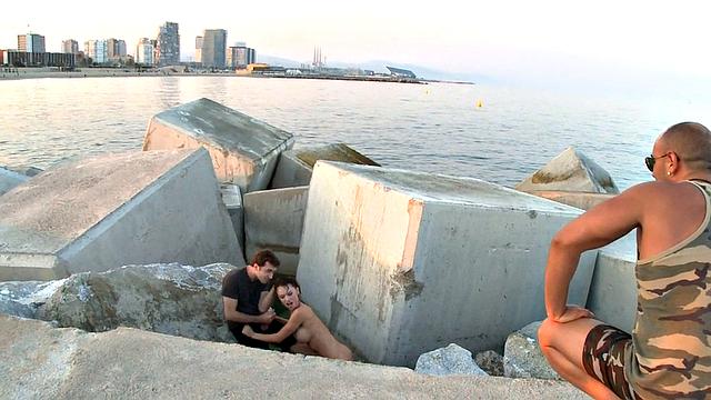 BDSM public slut deepthroats in front of outdoor voyeurs