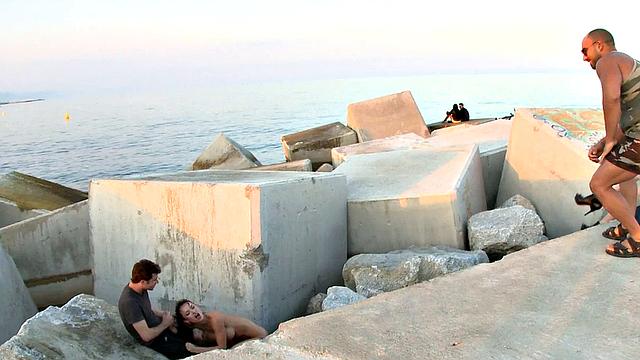 BDSM public slut deepthroats in front of outdoor voyeurs