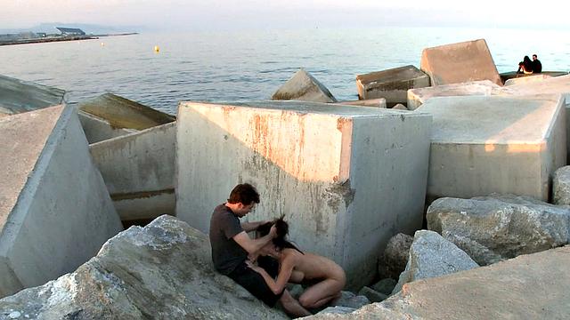 BDSM public slut deepthroats in front of outdoor voyeurs