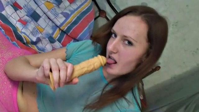 Hot Brunette with natural titrs Sucking Dildo