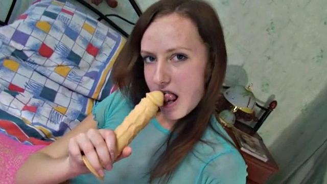 Hot Brunette with natural titrs Sucking Dildo