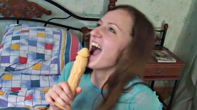 Hot Brunette with natural titrs Sucking Dildo