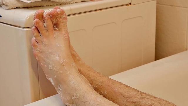 Adam fills his bathtub with warm sudsy water and dips his naked twink body down into the tub. Adam has an insatiable male foot fetish, especially for his own boy feet. He loves the warm water and the feel of the suds sliding down his soles.