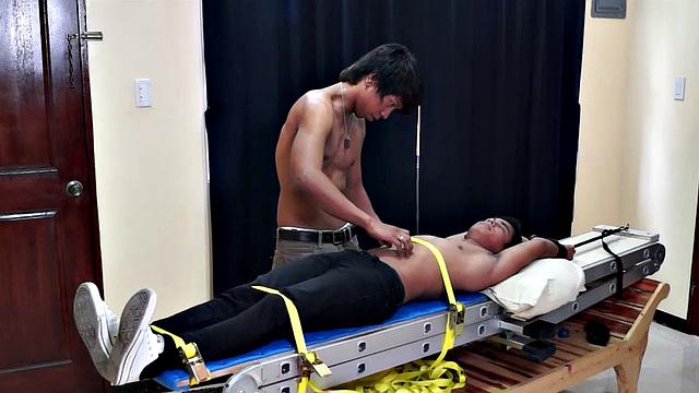 Get ready for a super kinky, super erotic tickle fetish experience with a cute and sexy Asian boy and an exceptionally hot gay Asian boy as the tickler. Hermis has Willy strapped down on the tickle rack for his kinky enjoyment.