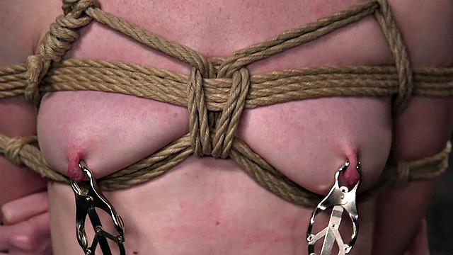 Kinky redhead gets her tight pussy and nipples dominated before getting a rough facefuck and spanking