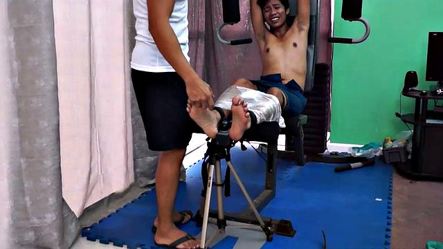 These boys just keep coming for a workout, and they surely get one! This time Asian cutie Idol gets restrained to the equipment for a hearty tickle workout on every muscle of his body.