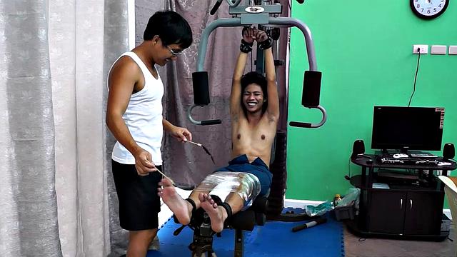 These boys just keep coming for a workout, and they surely get one! This time Asian cutie Idol gets restrained to the equipment for a hearty tickle workout on every muscle of his body.