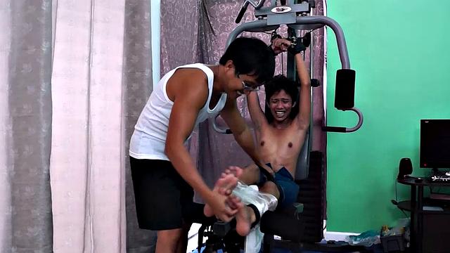 These boys just keep coming for a workout, and they surely get one! This time Asian cutie Idol gets restrained to the equipment for a hearty tickle workout on every muscle of his body.
