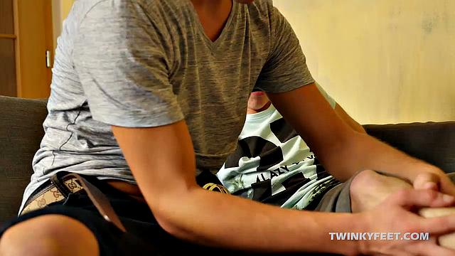 Jack brings home a cute white twink he met at the local gay bar, and can't wait to sniff the aroma of his feet. The two twinks get comfy on the couch and start making out.