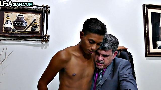 Business DILF fucks Asian twink in office and gets fucked