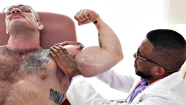 Muscle Black doctor jerks cock of muscled hunk