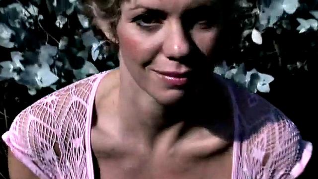 Short-haired blonde showing perfect tits in the open