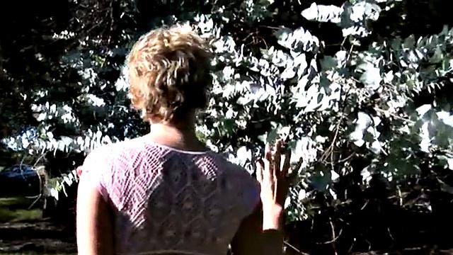 Short-haired blonde showing perfect tits in the open