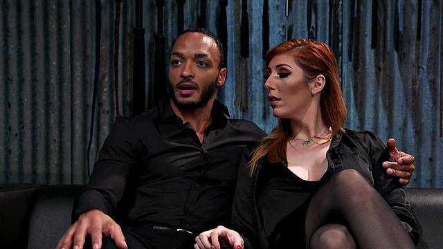 Strapon domina in leather lingerie fucks Black sub's ass