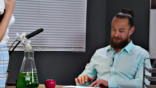 Oiled college babe rides professor cock in the classroom