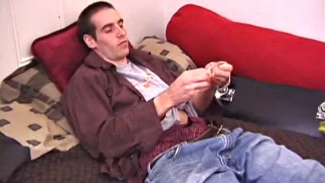 There's some good porn playing on the TV, so James Shafer decides to jack off. He pulls out his pierced dick and strokes it with determination, until he blows his warm cum load.