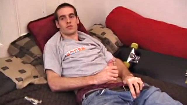 There's some good porn playing on the TV, so James Shafer decides to jack off. He pulls out his pierced dick and strokes it with determination, until he blows his warm cum load.