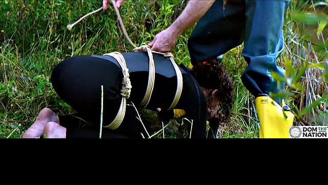 Lezdom babe in anal domination by a quiet serene river