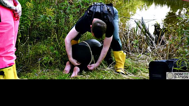 Lezdom babe in anal domination by a quiet serene river