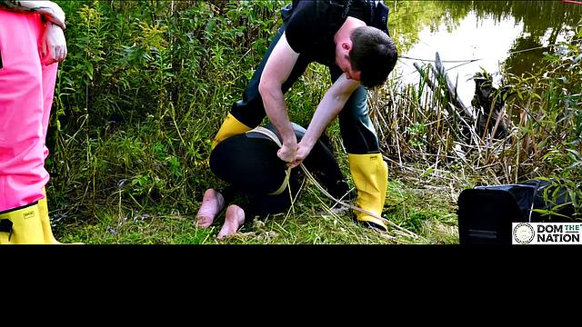 Lezdom babe in anal domination by a quiet serene river