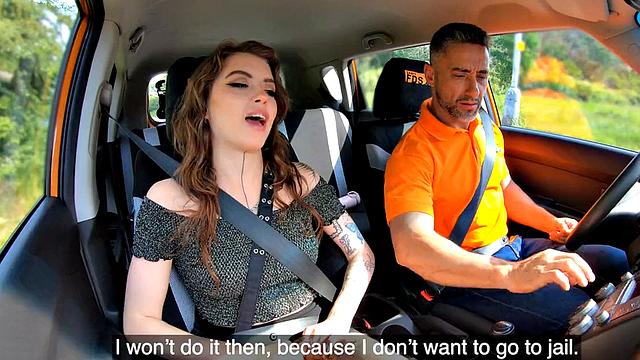 Inked driving student gives head