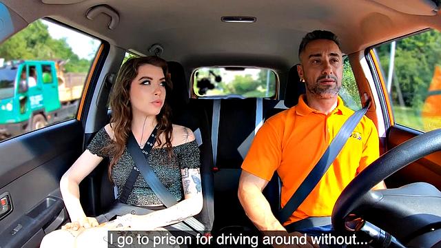 Inked driving student gives head