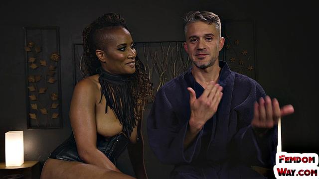 Whipping ebony female punishes male in BDSM session