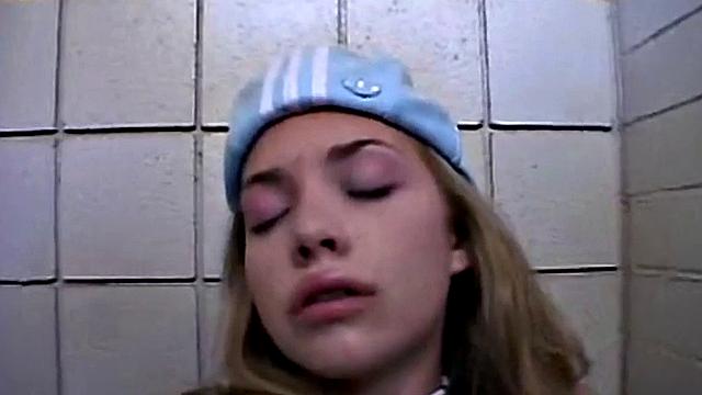 Watch Little April finger her pussy in public restroom while wearing her favorite sneakers and baseball cap