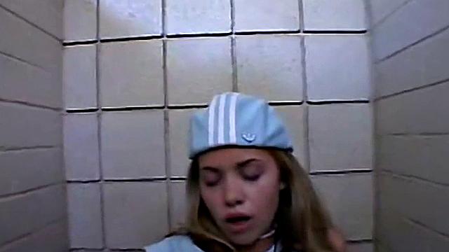 Watch Little April finger her pussy in public restroom while wearing her favorite sneakers and baseball cap