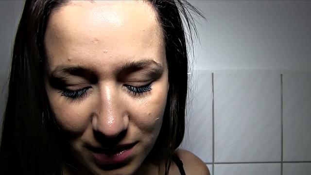 Cash-hungry brunette gives head in public restroom for cash