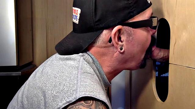 Gloryhole mature gay sucks cock in closeup