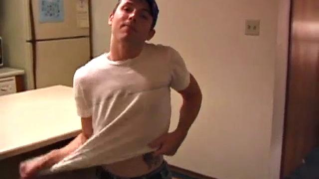 Christian Dane strips down to his undies. When they are removed we see this skinny little boy has a great big cock. He moves from sofa to bed, all the while fingering his ass and balls while steadily stroking that dick.