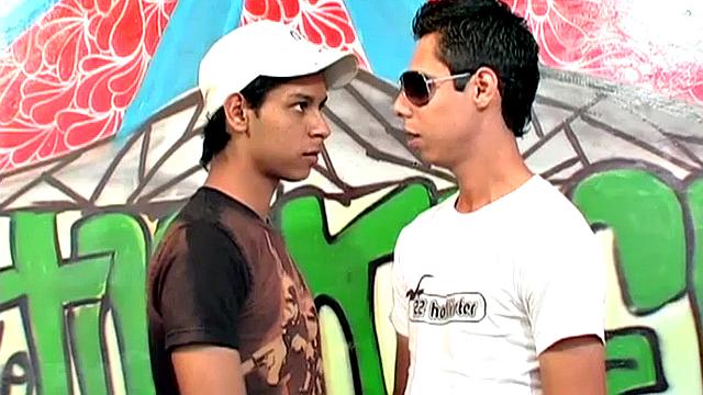 We look in on two Latin twinks with their pants down and cocks out; they kiss passionately, strip, have a hot oral exchange, and end up fucking.