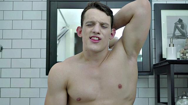 Muscle jock wanking hard cock solo in bathroom