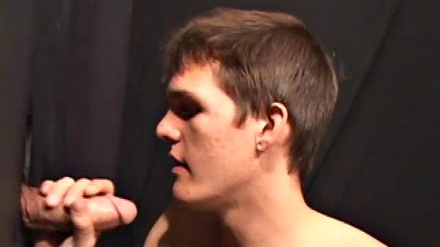 Sucking on a huge cock through a glory hole, 20 year old Nick shows us his oral skills. The one getting the blowjob obviously loves it and in no time the stud cums onto Nick's face.