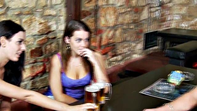 Strapon dominas peg guy's asshole in public cafe 3some